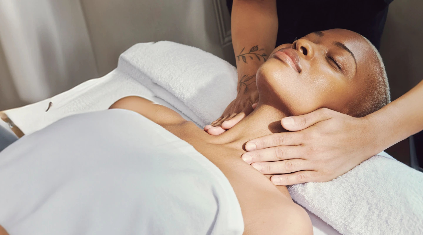 Client enjoys relaxing lymphatic drainage massage at home
