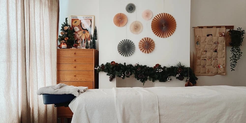 Massage table set up in apartment at Christmas