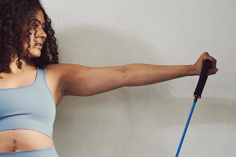 Woman doing exercise using a machine