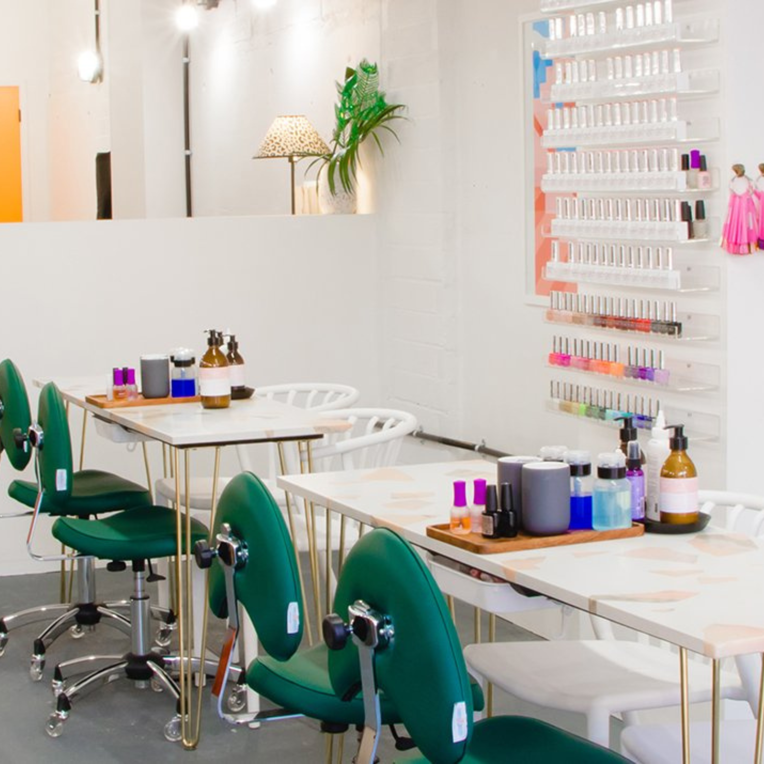 best nail salon in London, image of desks and chairs and an array of nail polish colours at Shoreditch Nails