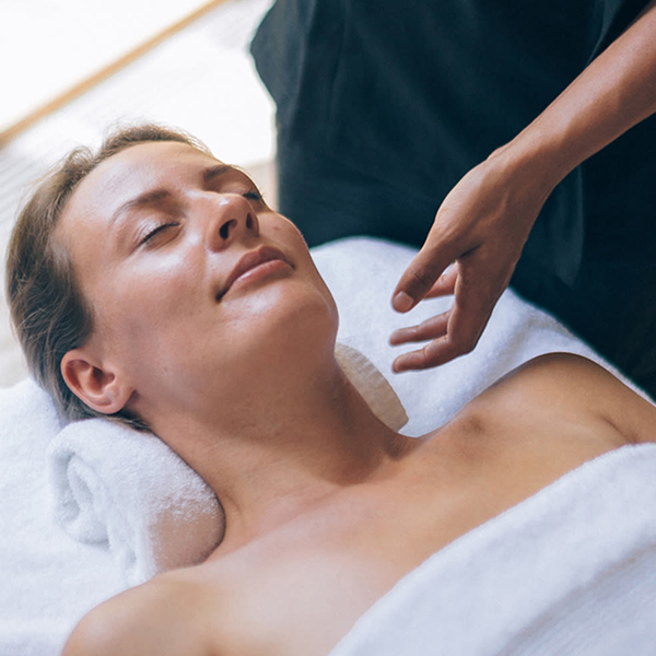 Woman relaxing during a massage with her eyes closed