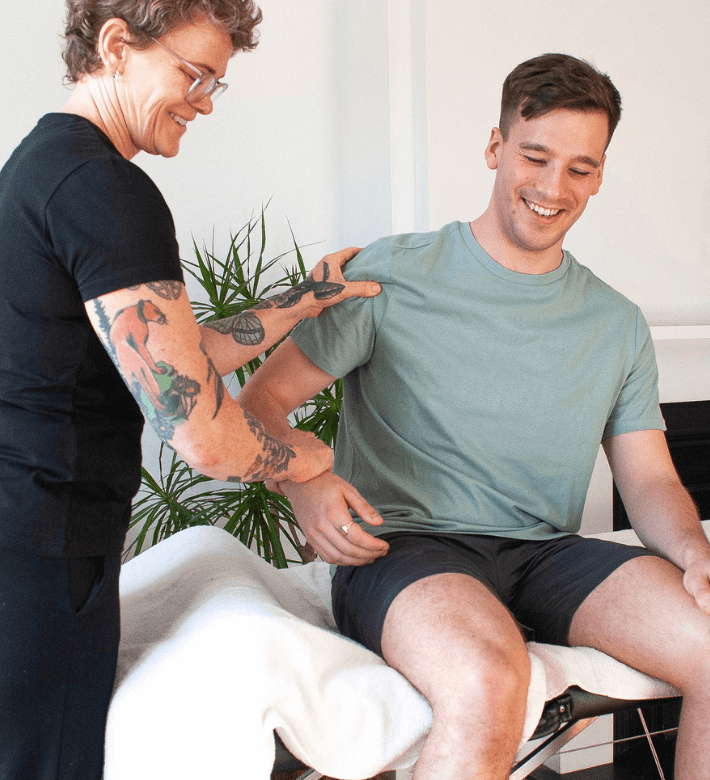 Client assessed by therapist during a sports massage